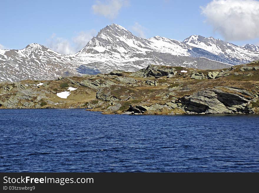 High altitude mountain lake in the swiss alps close to San Bernardino Pass. High altitude mountain lake in the swiss alps close to San Bernardino Pass