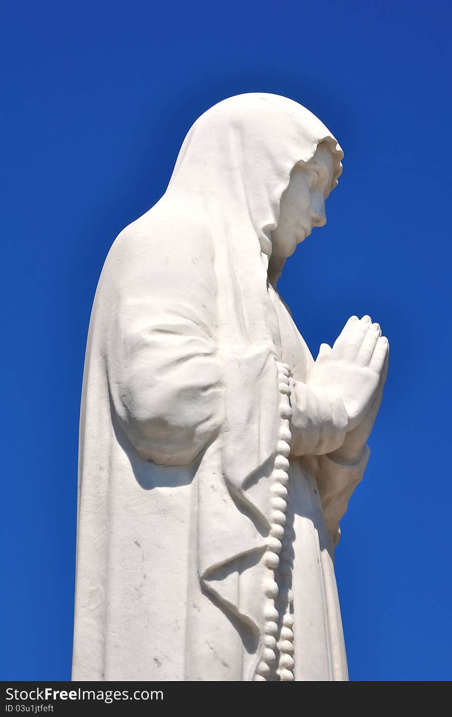 White Statue Representing A Prayer