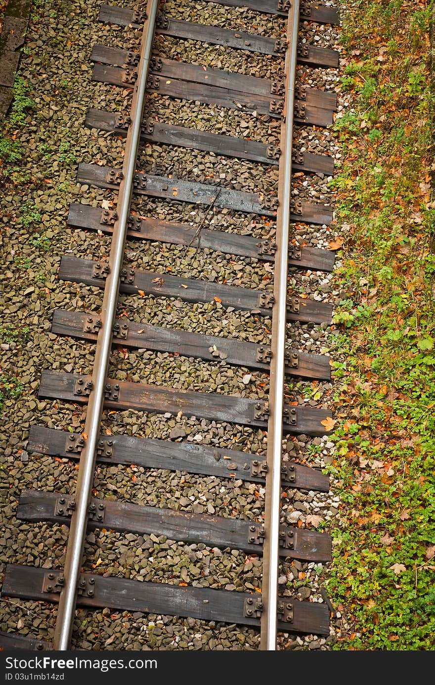 Steel rails with wooden sleepers, shot from the top