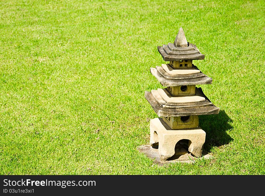 Chinese pavilion, carved out of stone on the lawn.