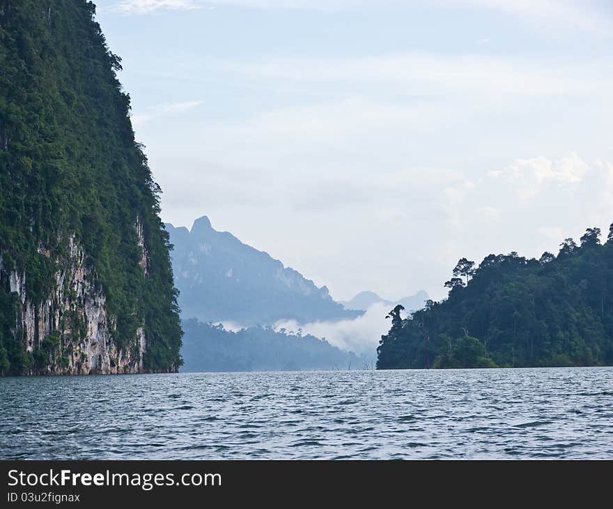 Natural scape, lake mountain and mist as background. Natural scape, lake mountain and mist as background