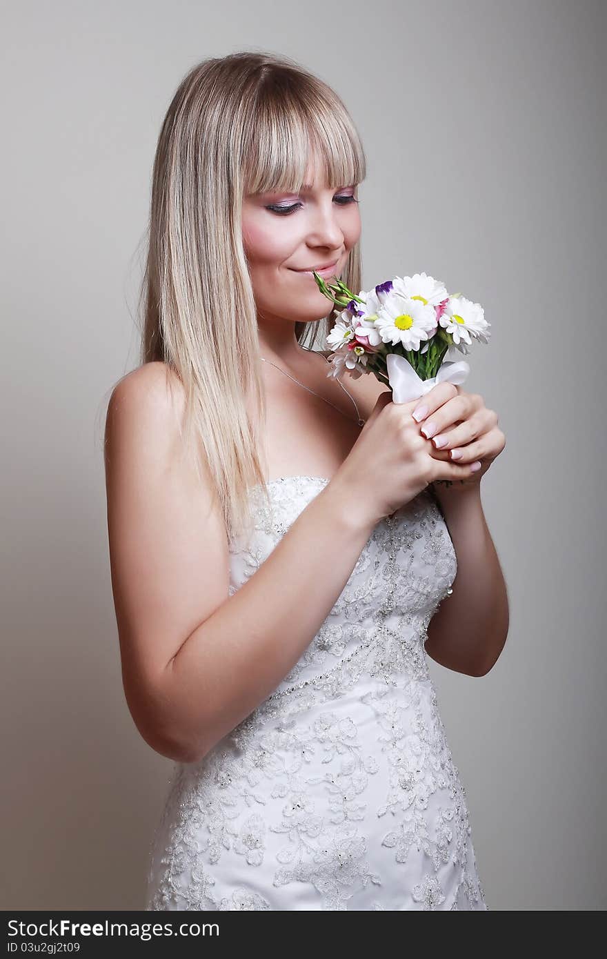 Portrait of happy bride with a bouquet. Portrait of happy bride with a bouquet