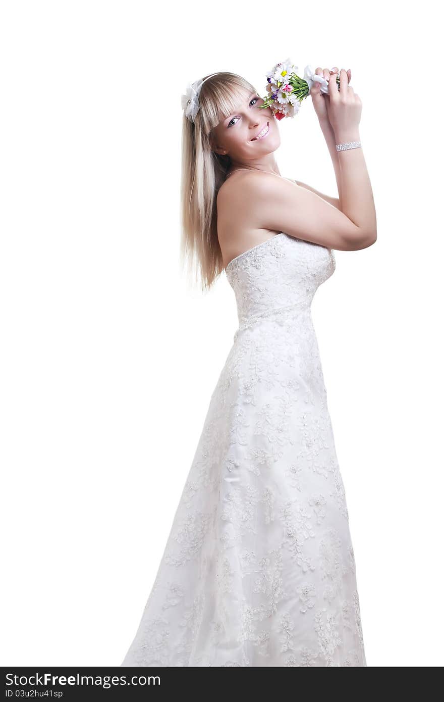 Beautiful young woman in a white dress