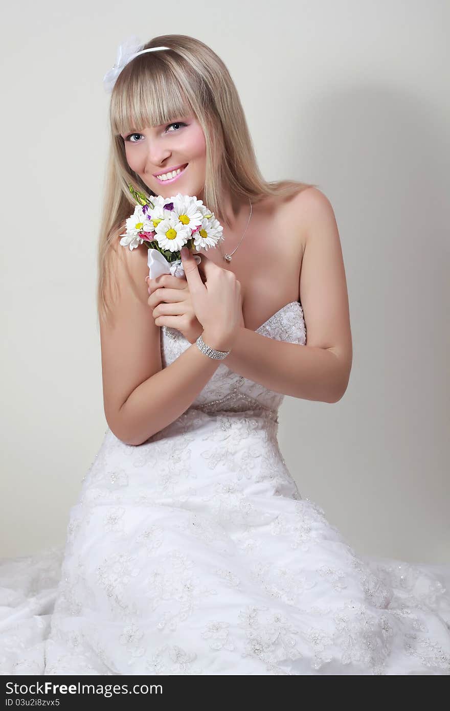 Portrait of happy bride with a bouquet. Portrait of happy bride with a bouquet