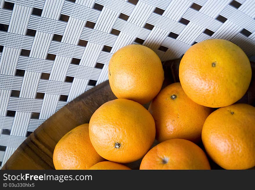 Group of fresh oranges in wooden tray with white background. Group of fresh oranges in wooden tray with white background