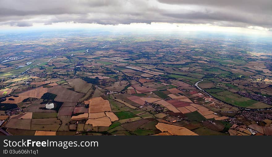 Aerial shot from just below the clouds of south Worcestershire with river Severn, River Avon and M50 motorway in view looking south England UK