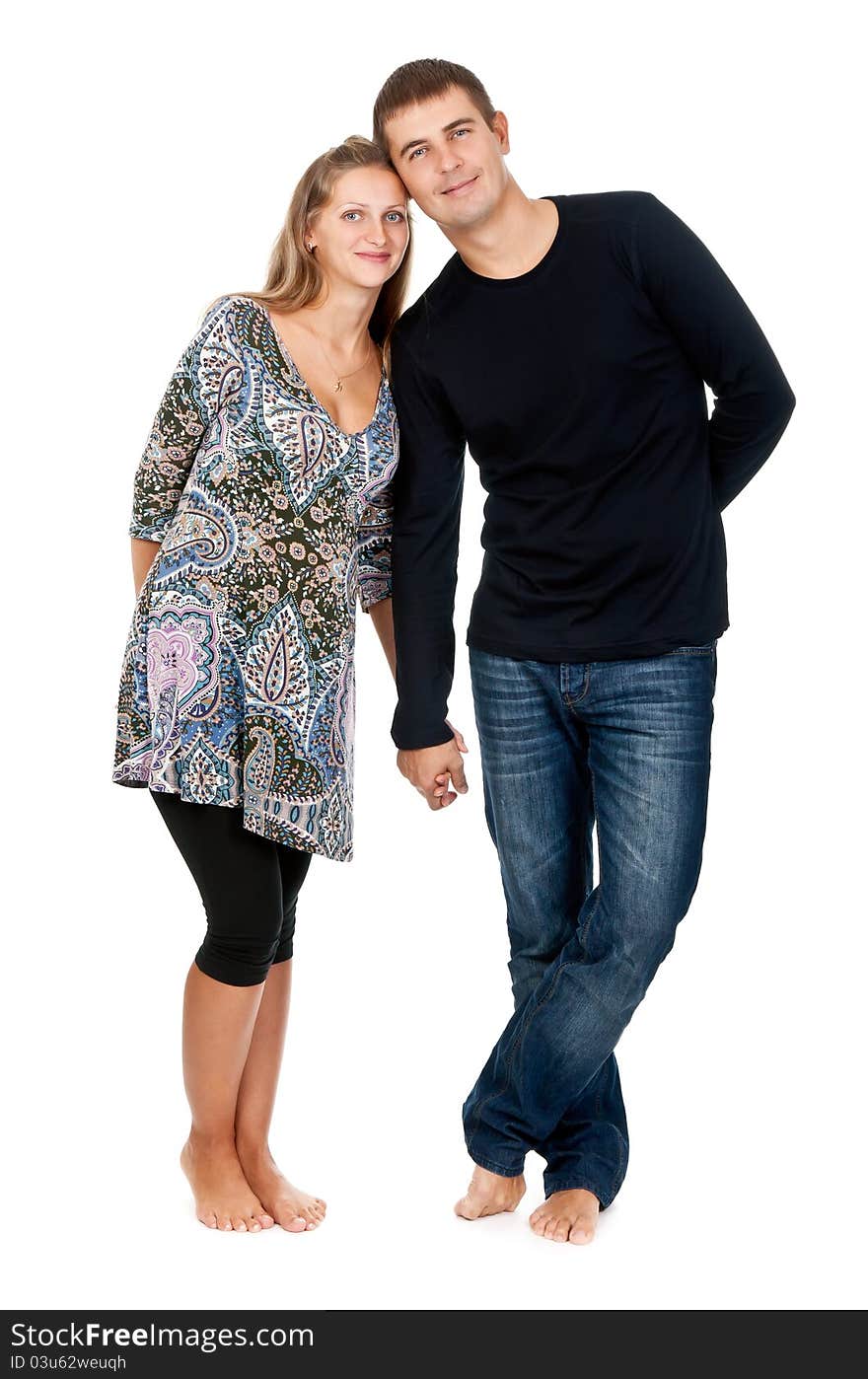 Beautiful couple in the studio on a white background