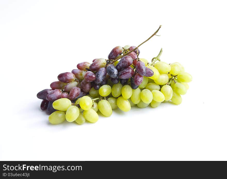 Green and red grapes  in a white background.