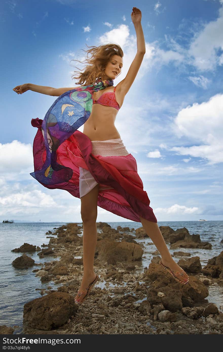 Girl jumping on beach