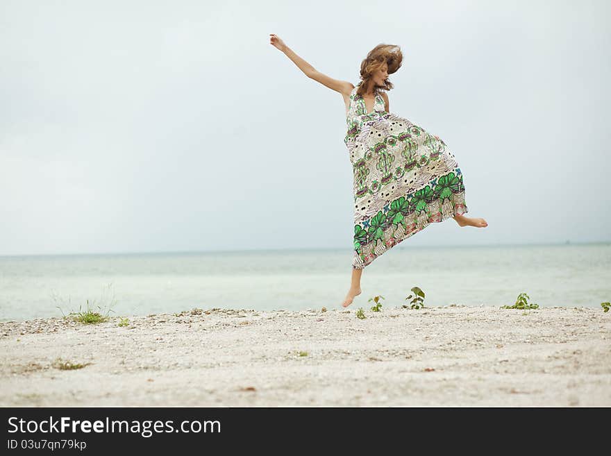 Girl jumping on beach