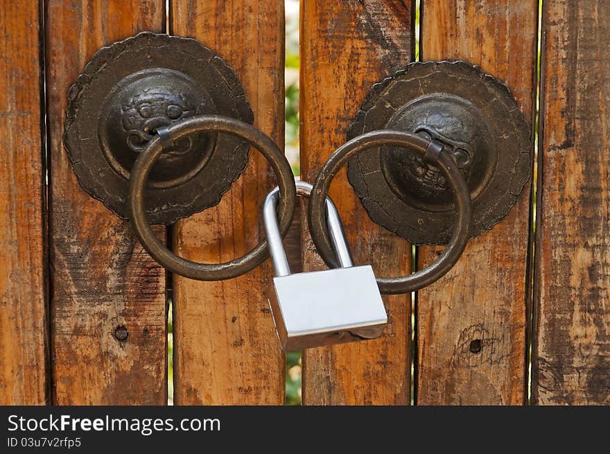 Wooden door with the old gold lock. Wooden door with the old gold lock