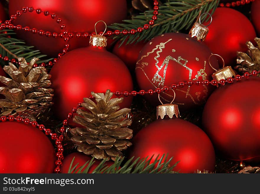 Gold candle with the twig of the spruce and cones. Gold candle with the twig of the spruce and cones