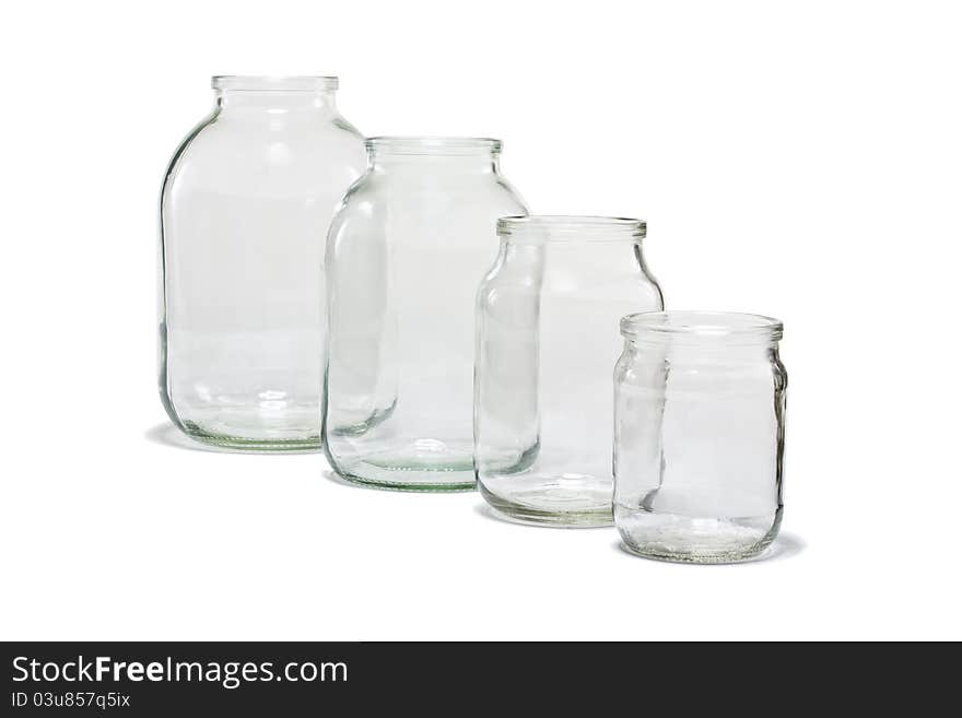 Empty glass jars on white background