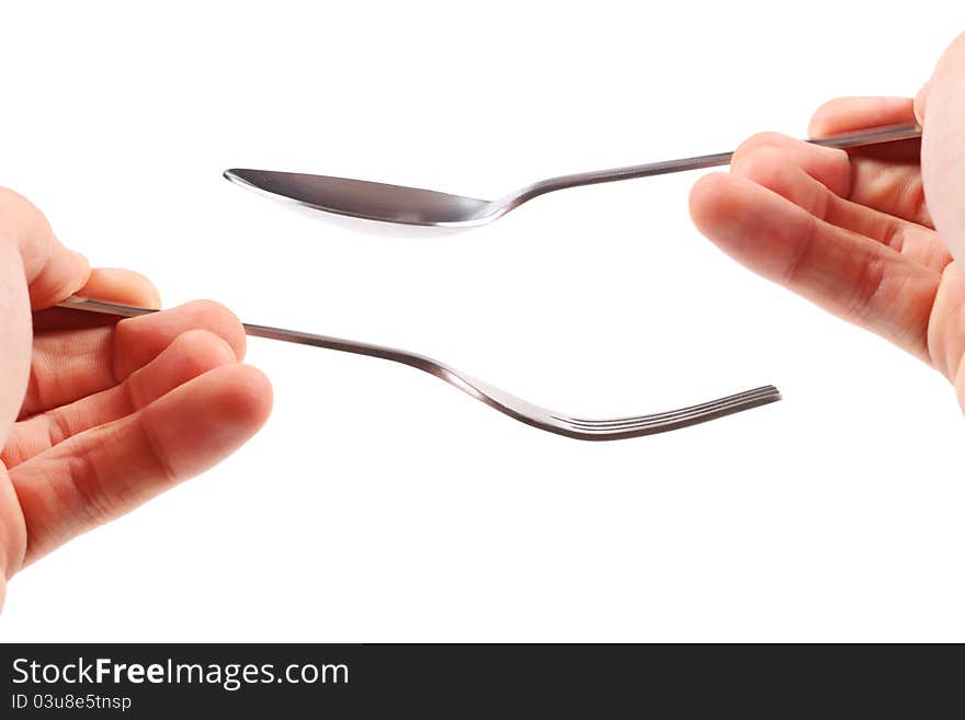 Fork and spoon in hands on white background