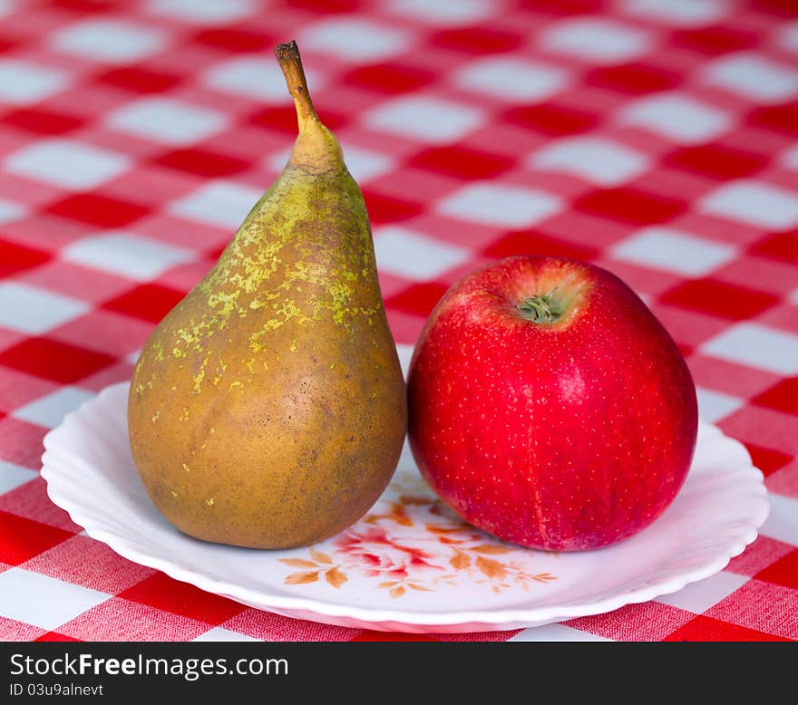 Delicious apple and pear on the table