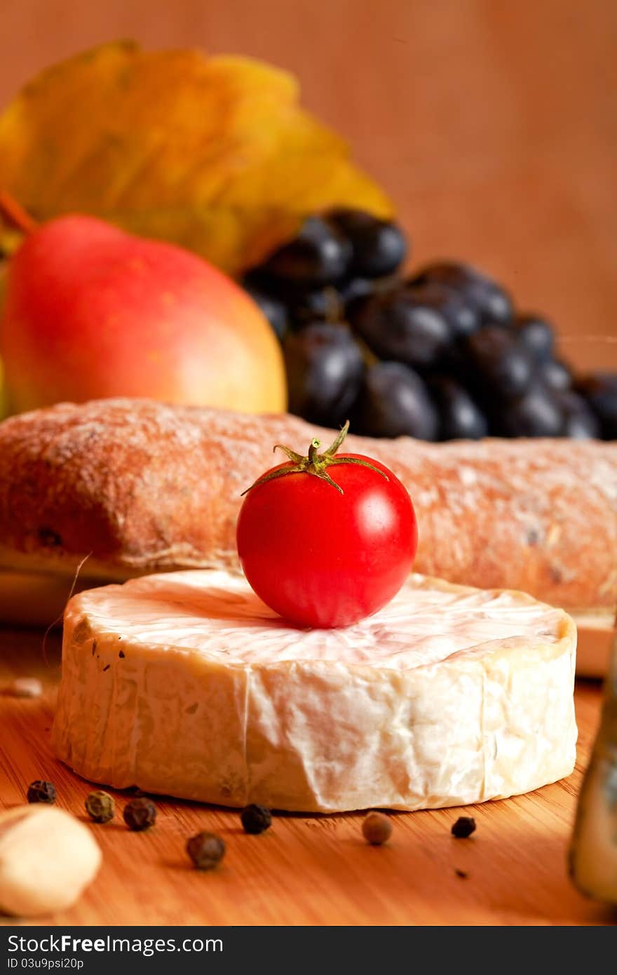 Still life with autumn vegetables , fruits  and cheese. Still life with autumn vegetables , fruits  and cheese