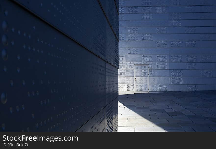 Modern architecture with door and shade in urban exterior scene. Modern architecture with door and shade in urban exterior scene