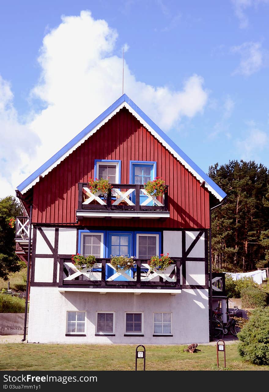 Residential house. Red, blue and white painted walls. Beautiful architectural solution.