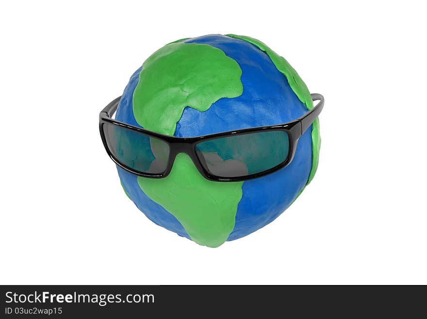 Sunglasses and plasticine globe on white background. Sunglasses and plasticine globe on white background