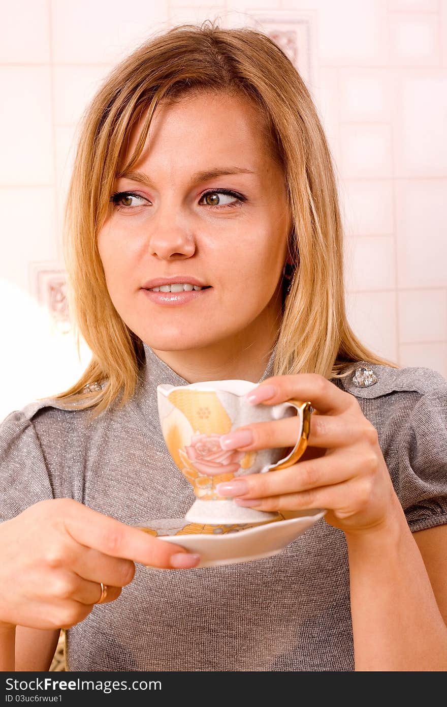 Girl keeping the cup in palms. Girl keeping the cup in palms