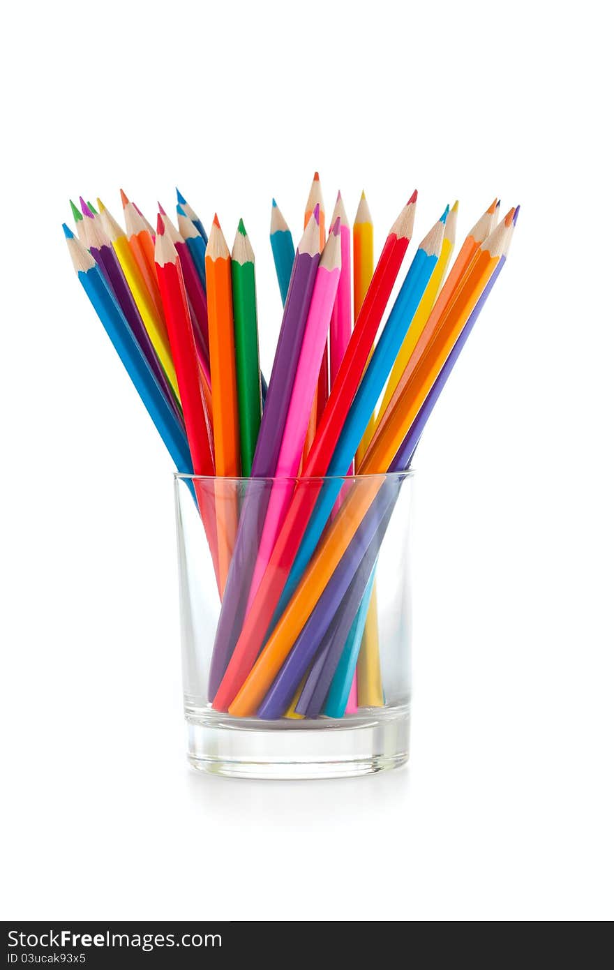 Color pencils pile in glass on white