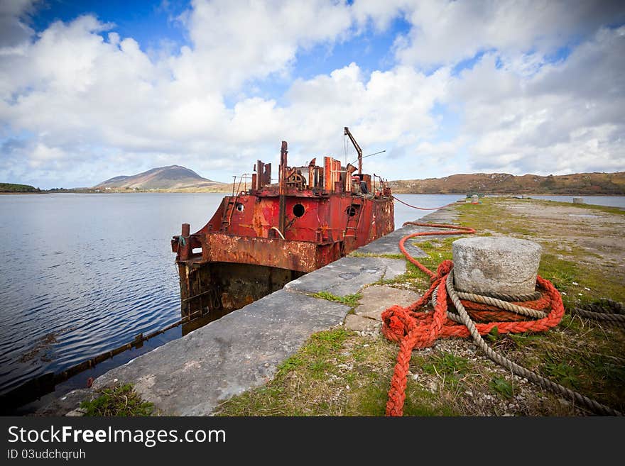 Rusty Ship Wreck at the pier in Connamara, Ireland