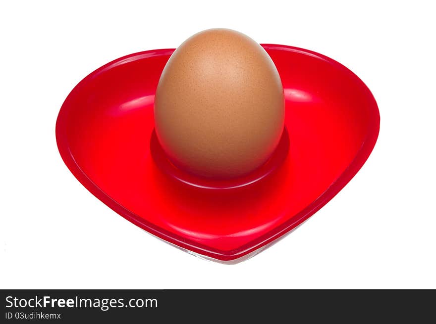 Egg on a stand in the shape of a heart