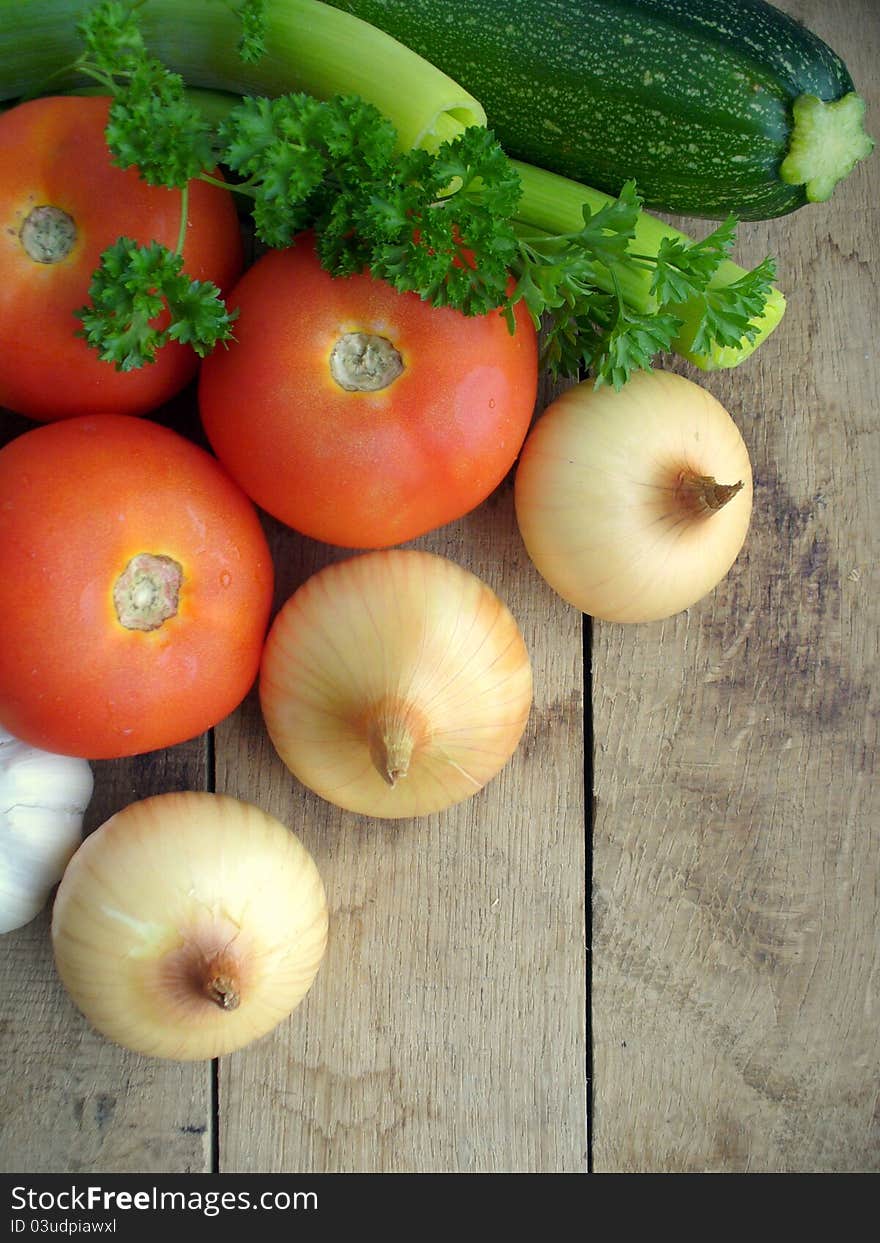 Fresh vegetables on a wooden background