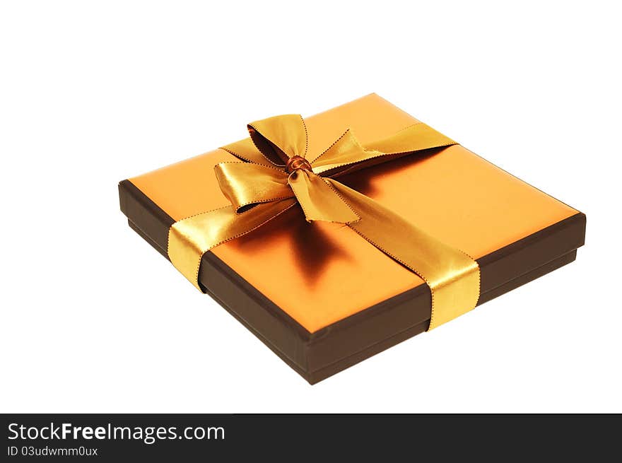 Gift box with gold  ribbon, on a white background