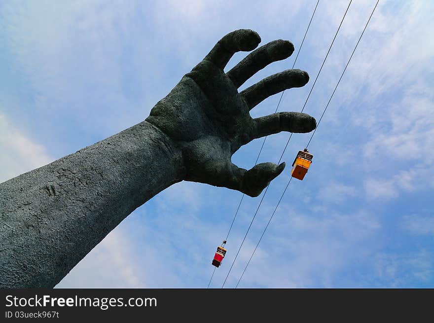 Giant arm catching cable car