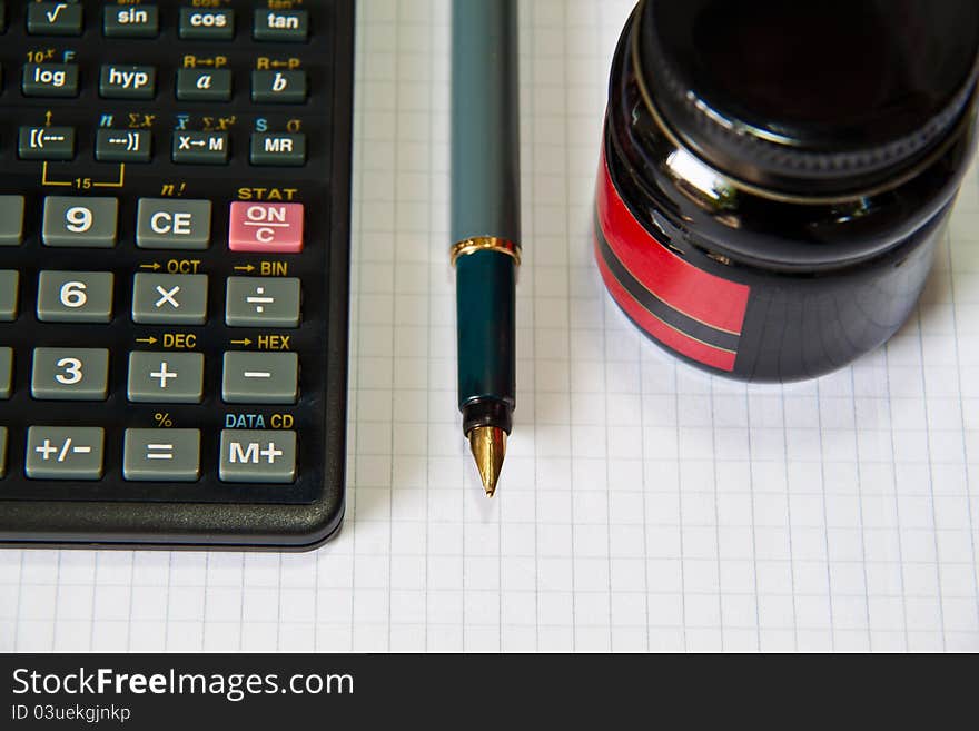 Classic and modern tools, pen, ink, book and calculator