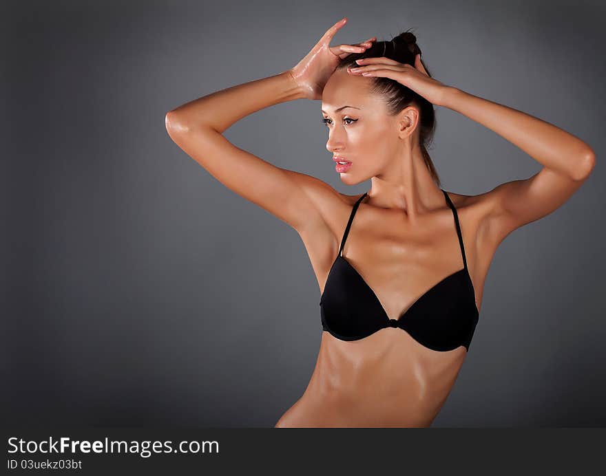 P young woman on a grey background