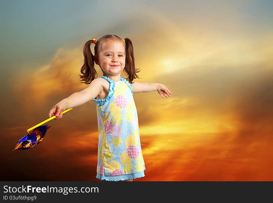 Happy Little Girl Playing With A Propeller