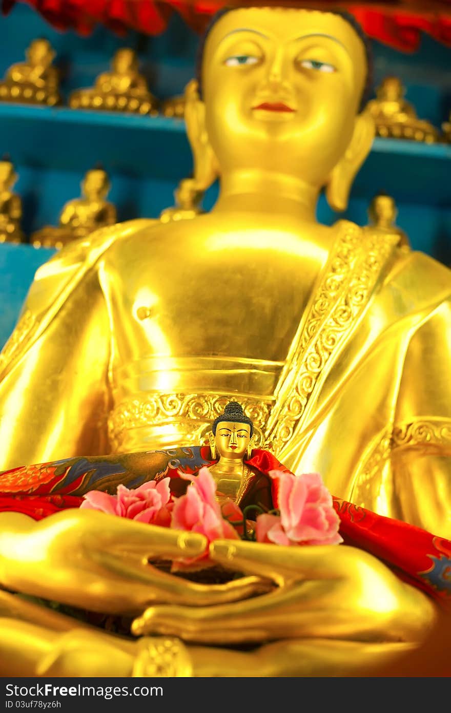 Golden Buddha sculpture in Tibetan Monastery