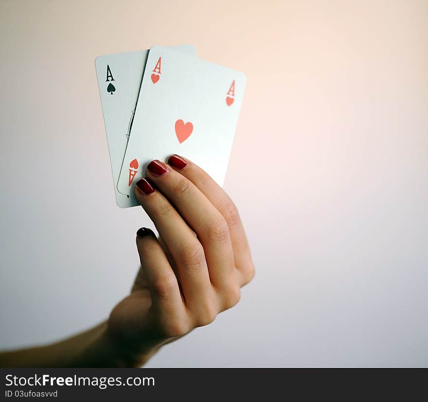 Woman with card poker aces