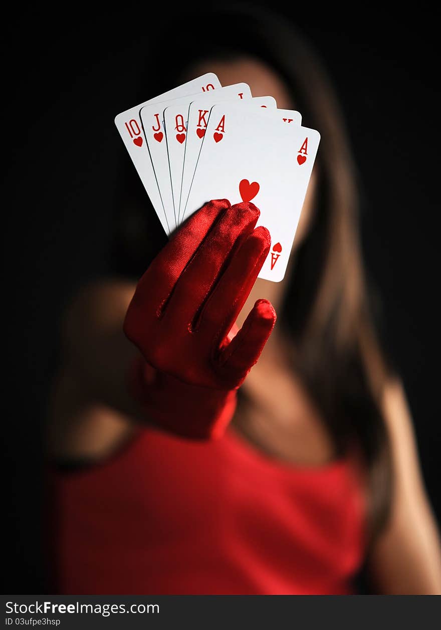 Female hand with royal flush on black bacground. Female hand with royal flush on black bacground