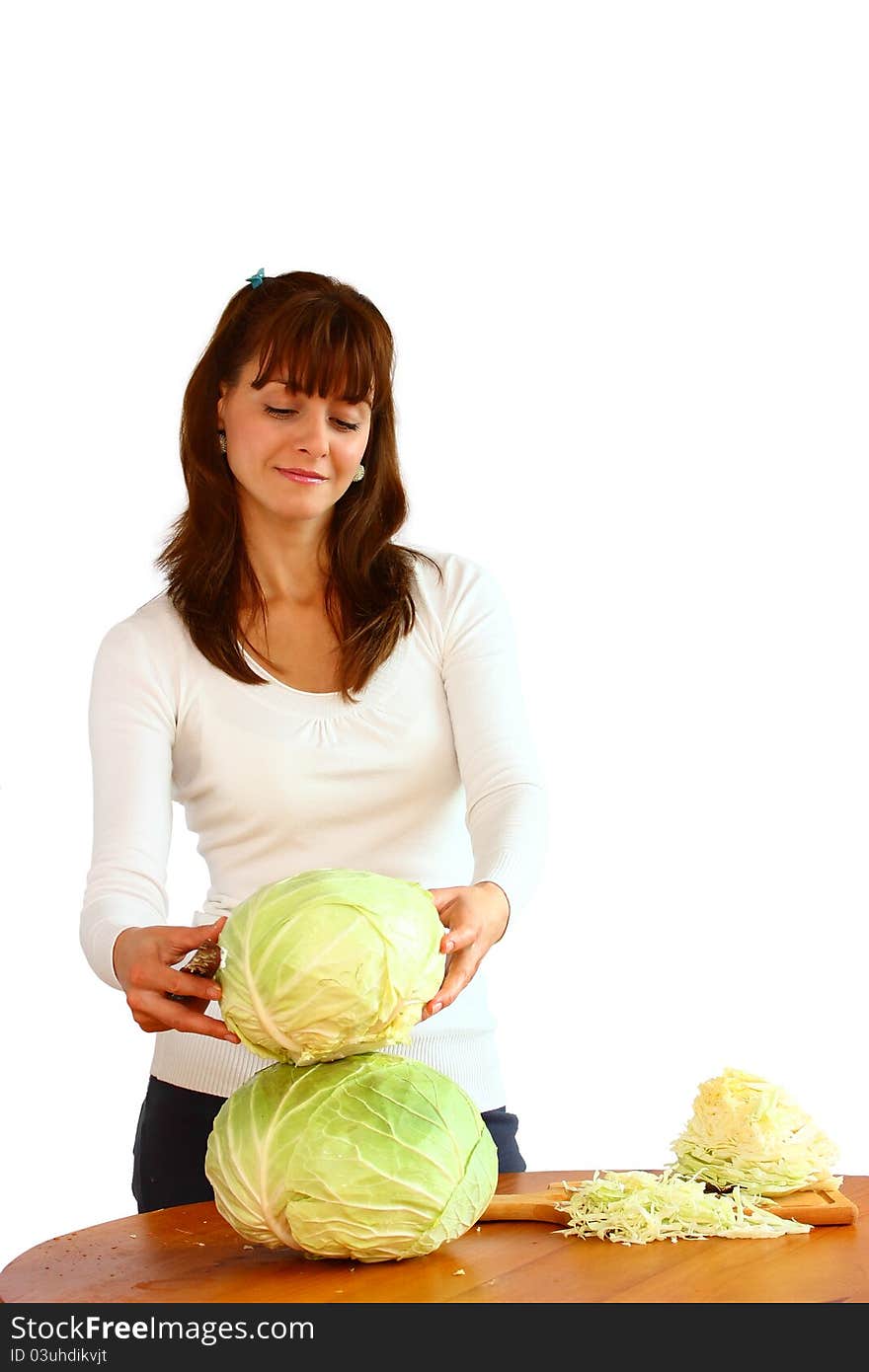 A beautiful woman holding cabbage isolated on a white background. A beautiful woman holding cabbage isolated on a white background