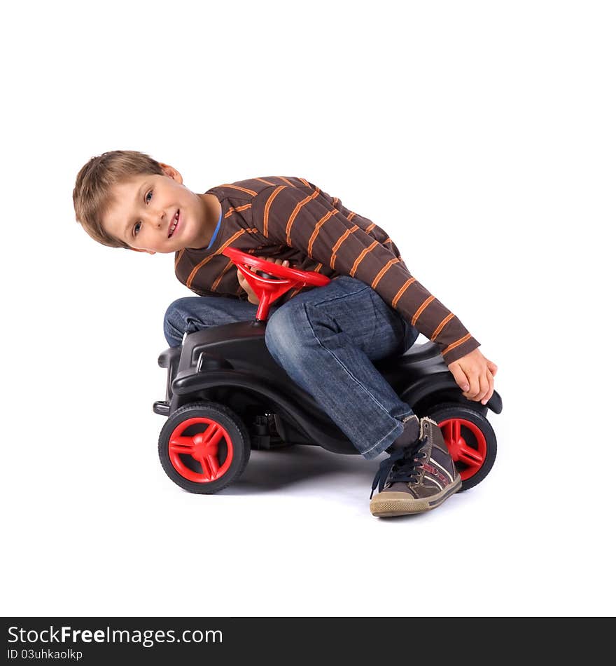 Young little boy playing with his car. Young little boy playing with his car