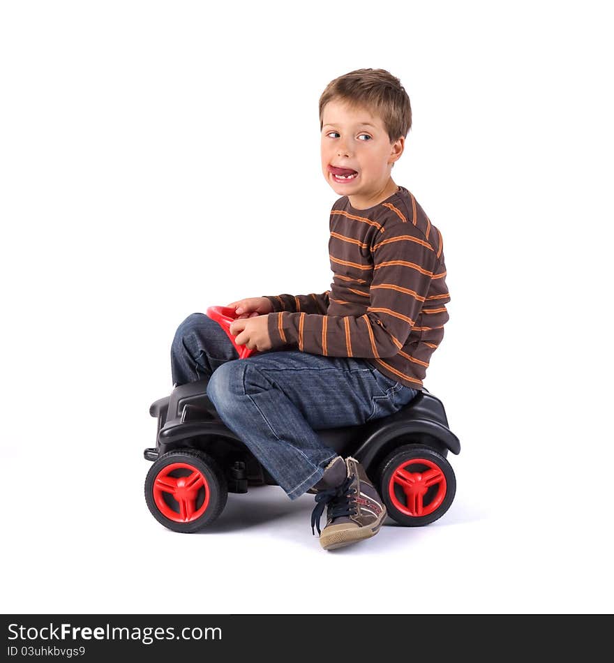 Young little boy driving his car. Young little boy driving his car