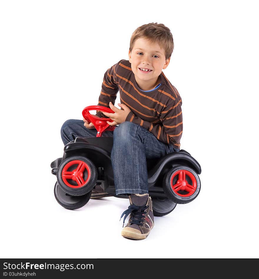 Young little boy playing with his car. Young little boy playing with his car