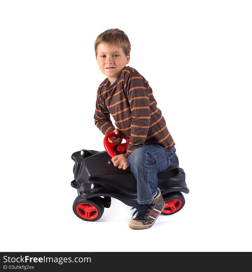 Young little boy playing with his car. Young little boy playing with his car