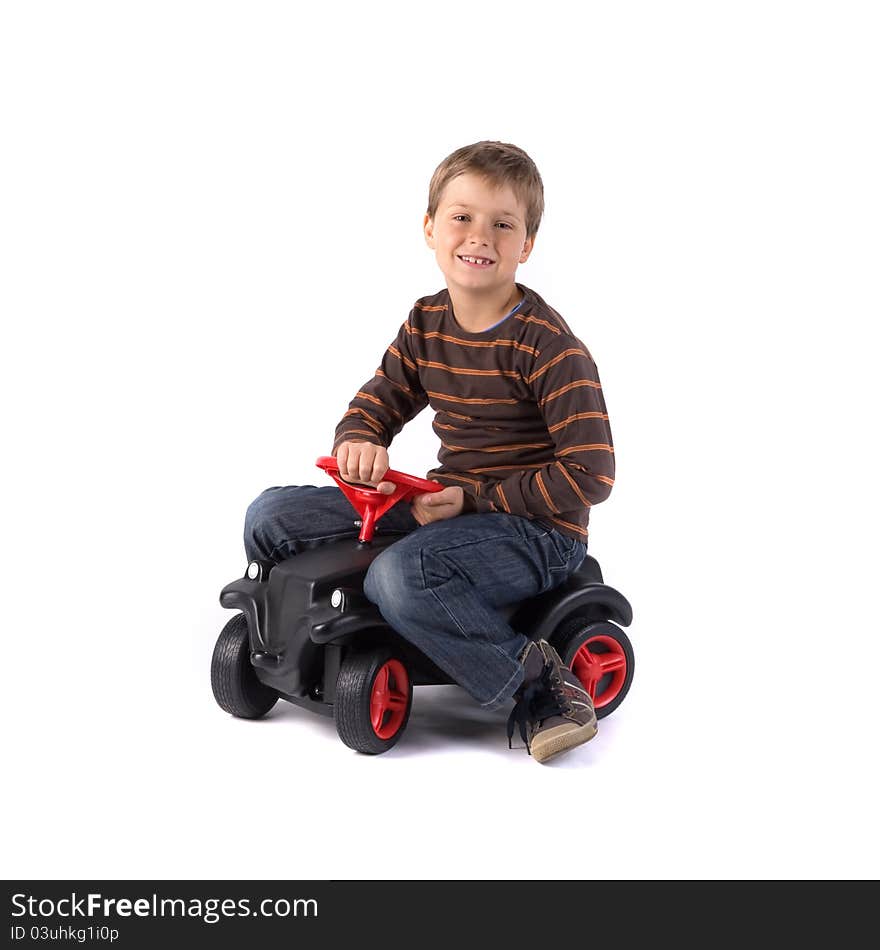 Young little boy driving his car. Young little boy driving his car