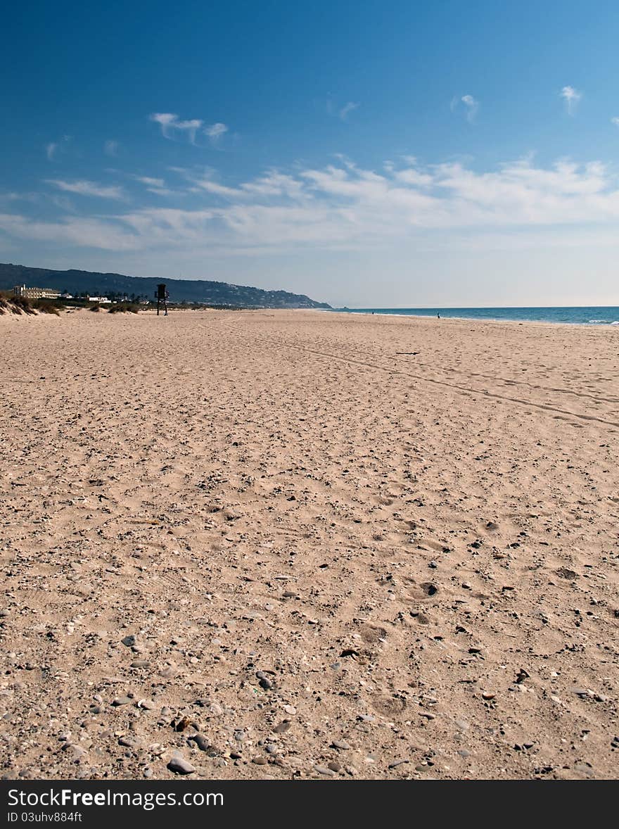 Beach in the Spanish town of Zahara, a clear day, you see the sand hills in the background. Beach in the Spanish town of Zahara, a clear day, you see the sand hills in the background