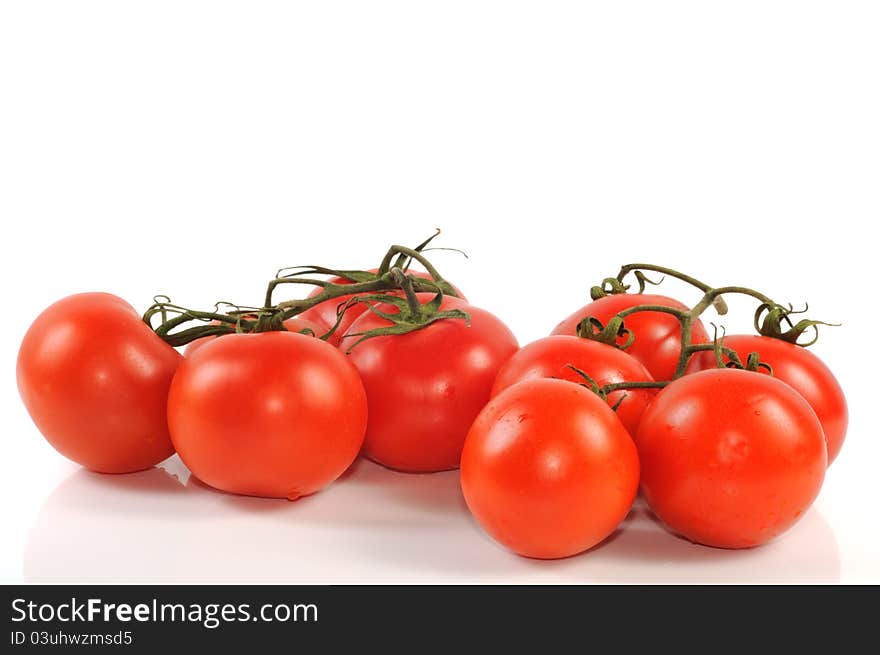 Fresh red tomatos  on a white background