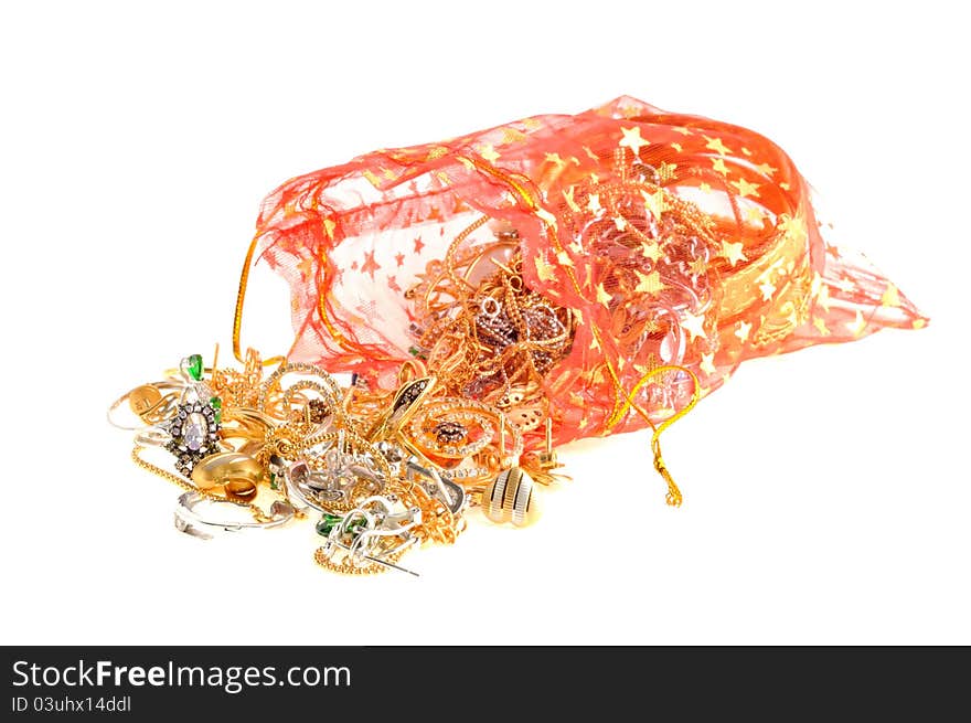 Full red bag of a gold jewelry on a white background. Full red bag of a gold jewelry on a white background