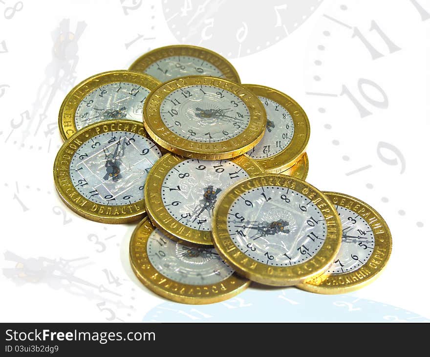 Coins in the form of hours on a white background. Coins in the form of hours on a white background