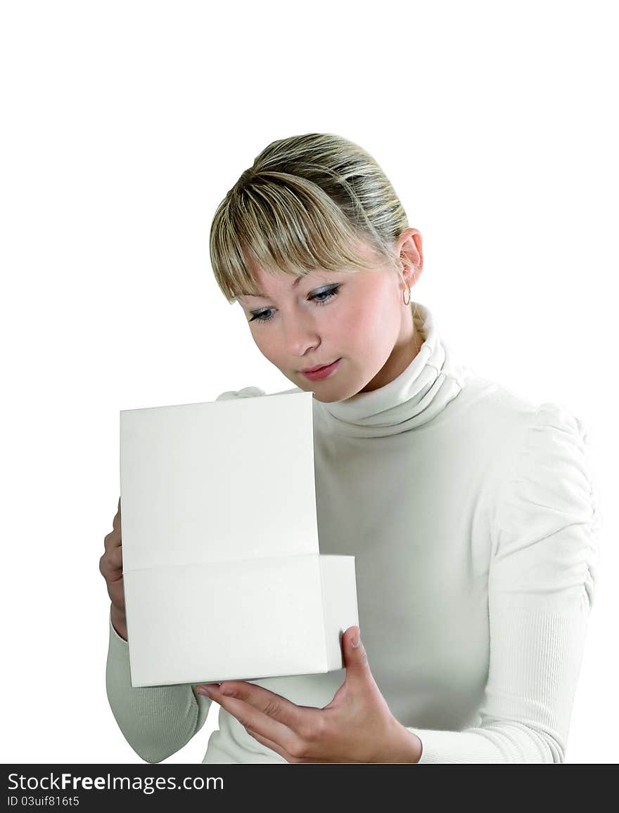 Pretty young girl looks in a white cardboard box