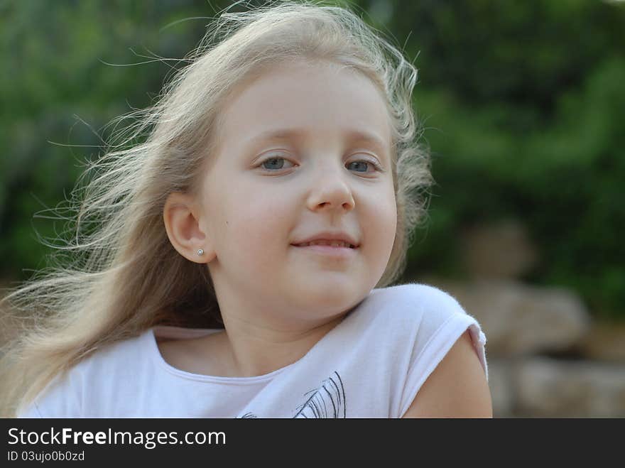 Portrait of a girl in a green forest. Portrait of a girl in a green forest