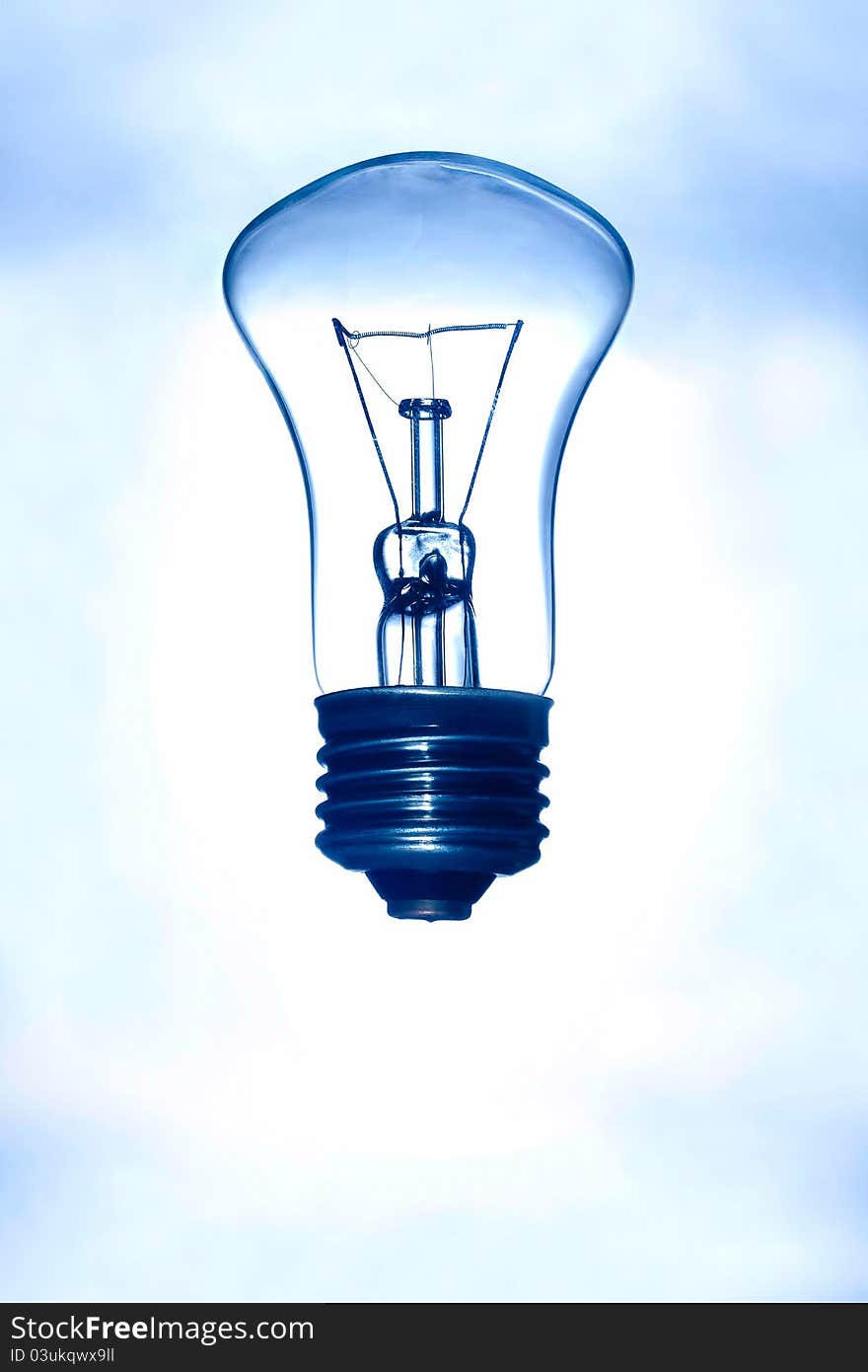 Light bulb on a blue background. Light bulb on a blue background