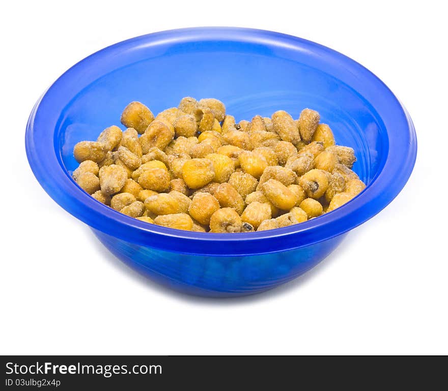 Blue bowl with fried corn on white background